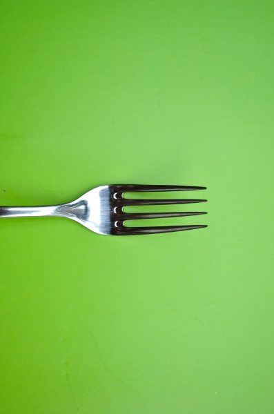 Fork on a green background